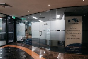 Windows at front of Feet In Motion Podiatry. Clean modern entrance.